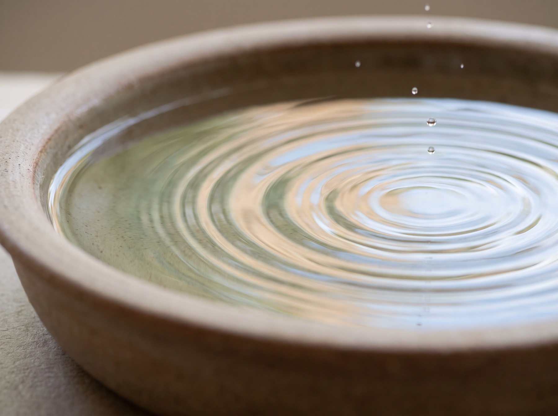 Close-up of gentle ripples on still water